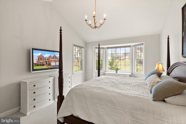 bedroom featuring multiple windows, lofted ceiling, carpet flooring, and a chandelier