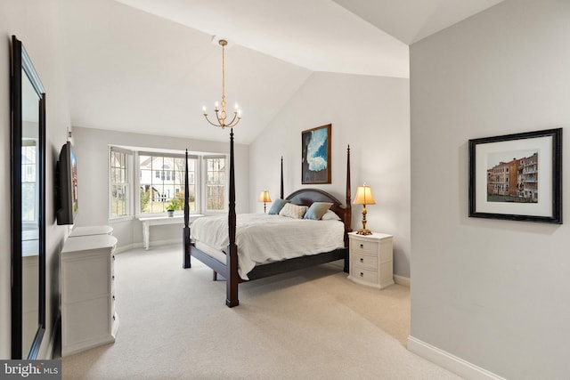 carpeted bedroom featuring vaulted ceiling and a chandelier