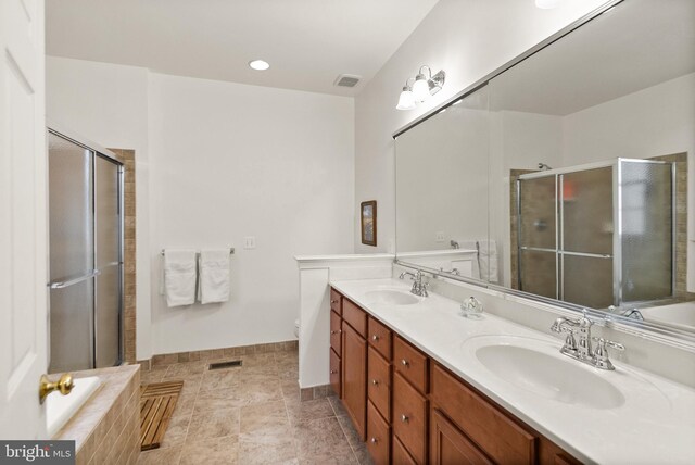 full bathroom featuring vanity, separate shower and tub, and toilet