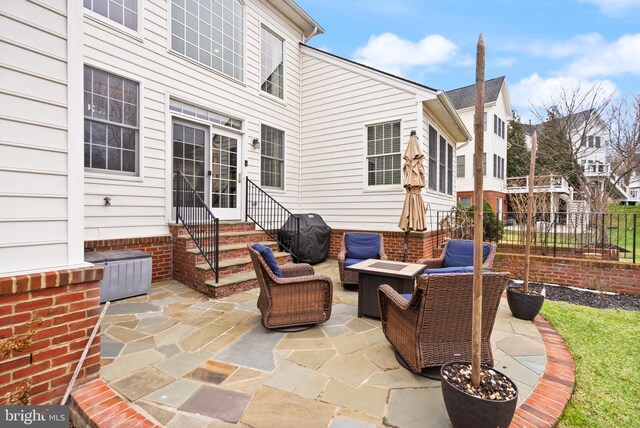 view of patio with grilling area and an outdoor hangout area