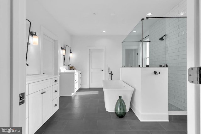 bathroom with vanity, tile patterned floors, and separate shower and tub