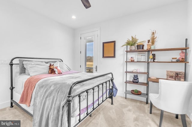 bedroom with ceiling fan, access to exterior, and light carpet