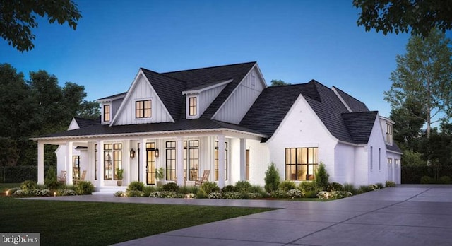 view of front of property with a porch and a front lawn