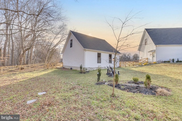 view of front of home with a yard