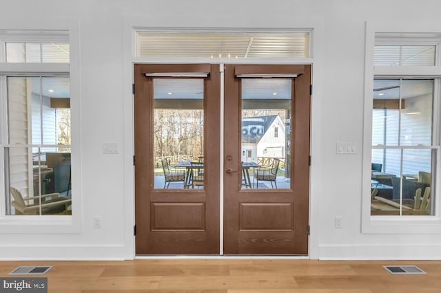 doorway featuring french doors and wood-type flooring