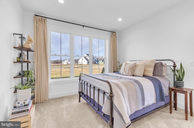 bedroom featuring light carpet