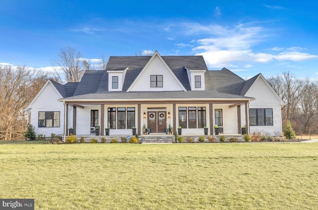 modern farmhouse style home featuring a front lawn and a porch