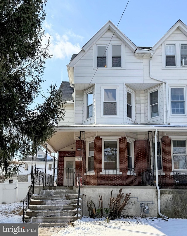 view of property featuring a porch