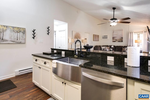 kitchen with sink, baseboard heating, dark hardwood / wood-style flooring, stainless steel dishwasher, and dark stone counters