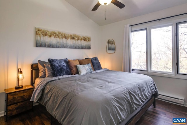 bedroom featuring dark wood-type flooring, a baseboard radiator, ceiling fan, and vaulted ceiling