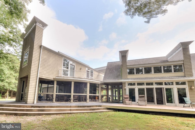 back of house with a sunroom