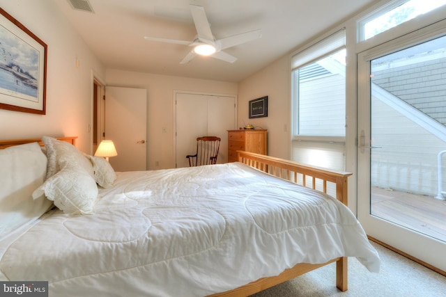 bedroom with ceiling fan, access to exterior, and a closet