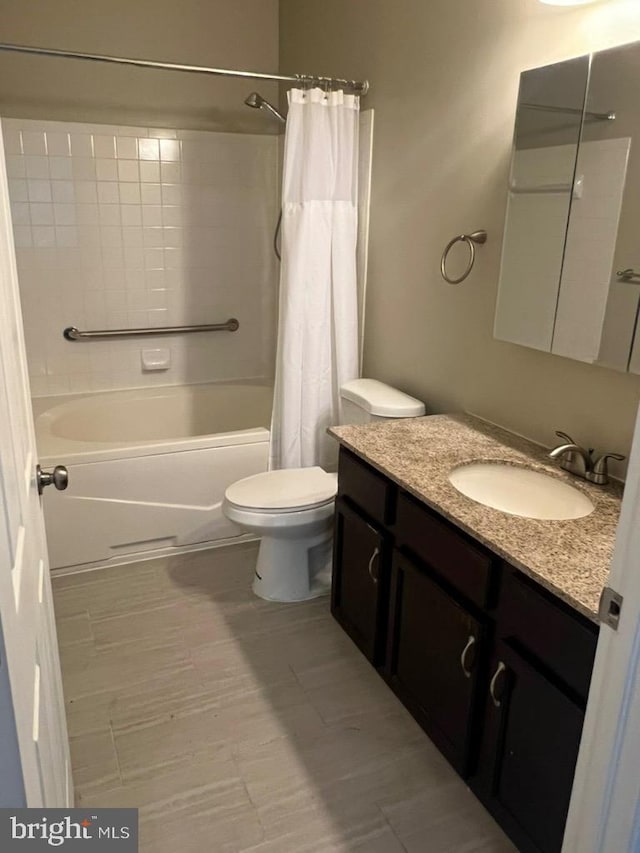 full bathroom featuring vanity, shower / bath combination with curtain, and toilet