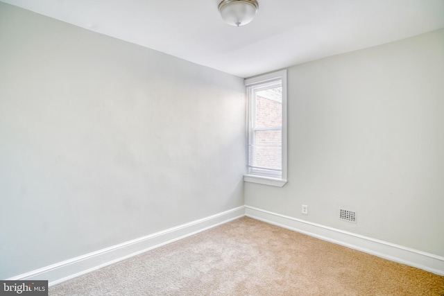 unfurnished room featuring carpet floors