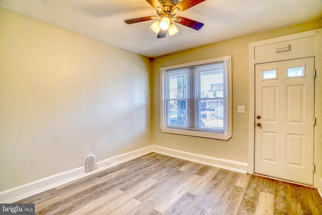 foyer featuring ceiling fan and light wood-type flooring