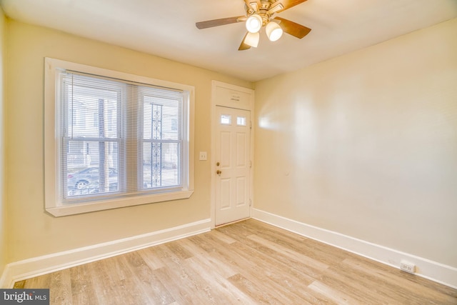 foyer with light hardwood / wood-style flooring and ceiling fan