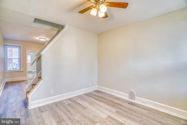 spare room with ceiling fan and light hardwood / wood-style floors