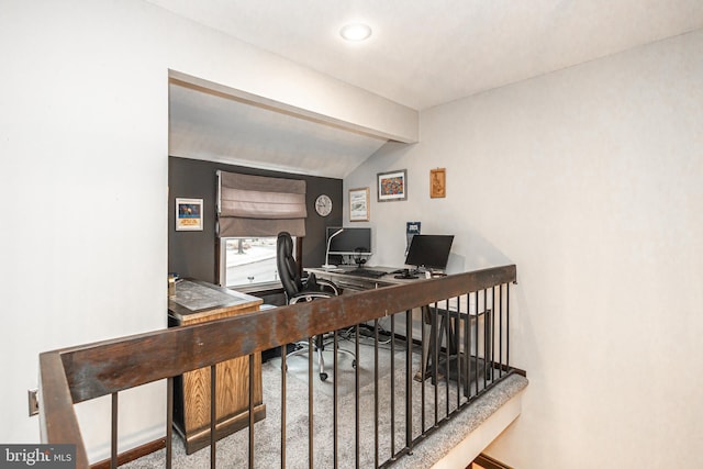 office space featuring carpet floors and vaulted ceiling with beams