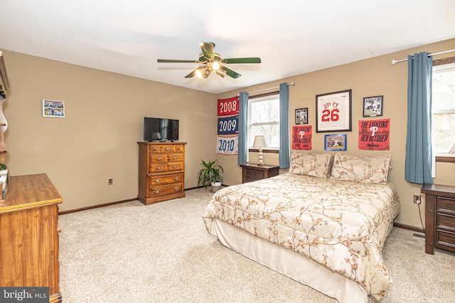 bedroom with carpet flooring, ceiling fan, and baseboards