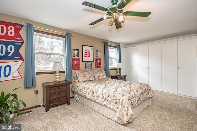 bedroom featuring carpet, visible vents, and a ceiling fan