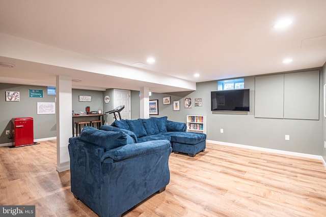 living room with recessed lighting, light wood-style flooring, and baseboards