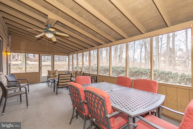 sunroom / solarium with lofted ceiling with beams and a ceiling fan