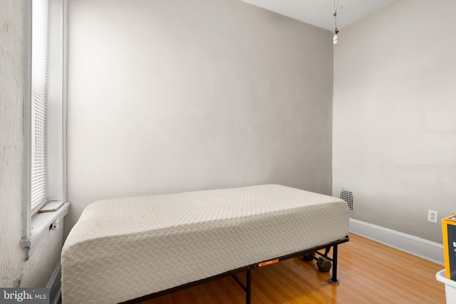 bedroom featuring hardwood / wood-style floors