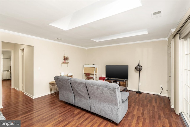 living room with crown molding, dark wood-type flooring, and a skylight