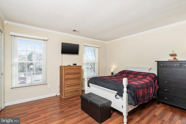 bedroom featuring multiple windows, crown molding, and dark hardwood / wood-style floors