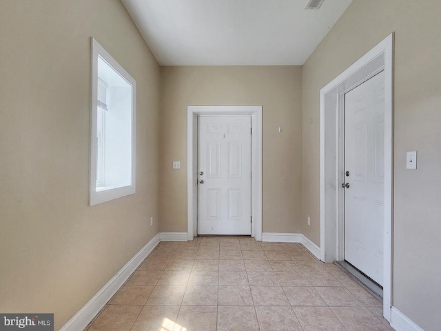 interior space featuring light tile patterned flooring