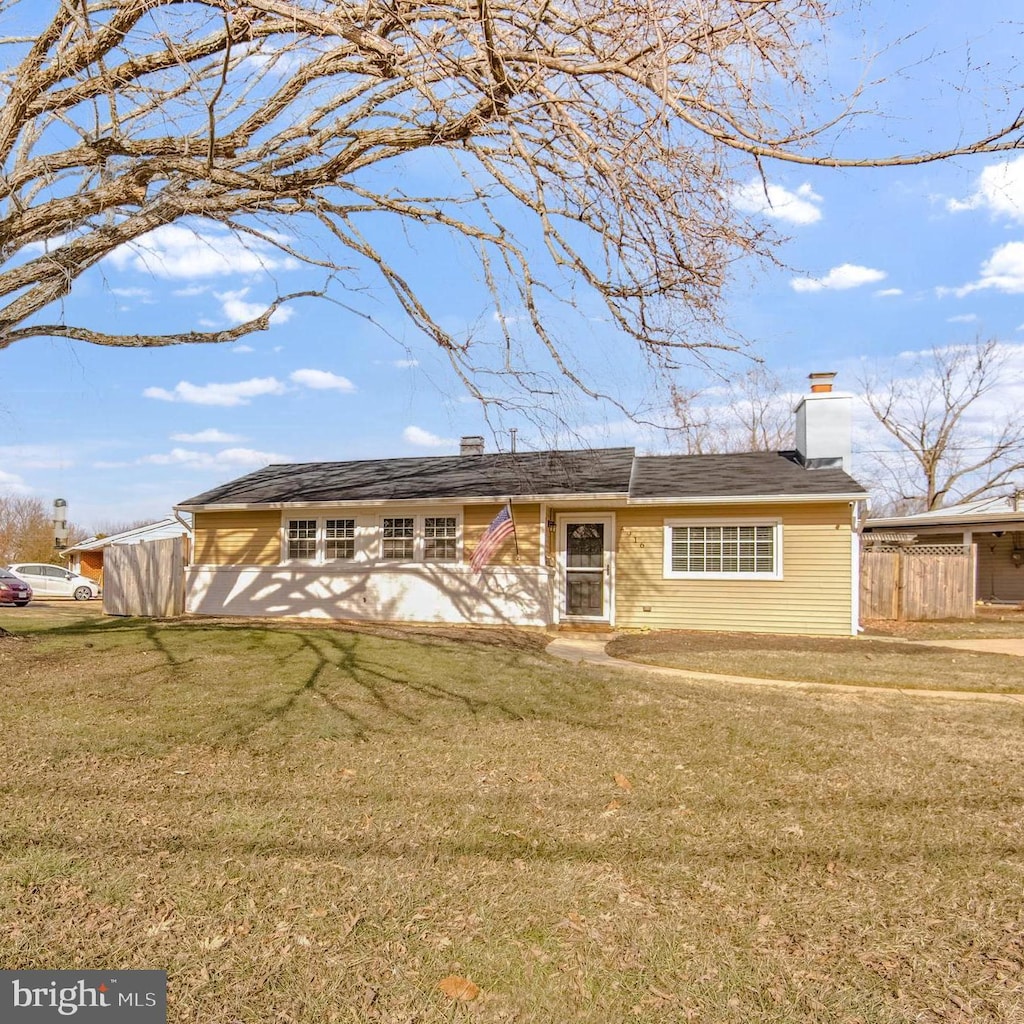 ranch-style house with a front lawn