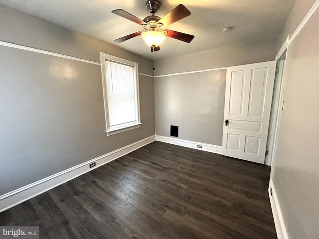 unfurnished bedroom featuring dark hardwood / wood-style floors and ceiling fan