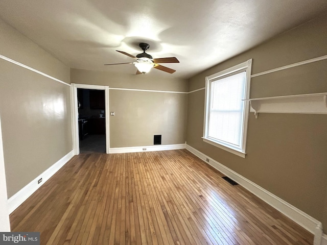 unfurnished bedroom with hardwood / wood-style floors and ceiling fan