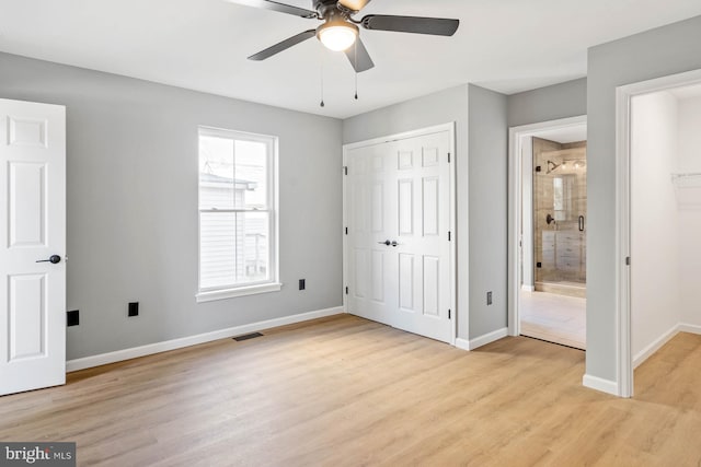 unfurnished bedroom with ceiling fan, connected bathroom, and light hardwood / wood-style flooring