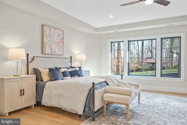 bedroom featuring light hardwood / wood-style floors and ceiling fan