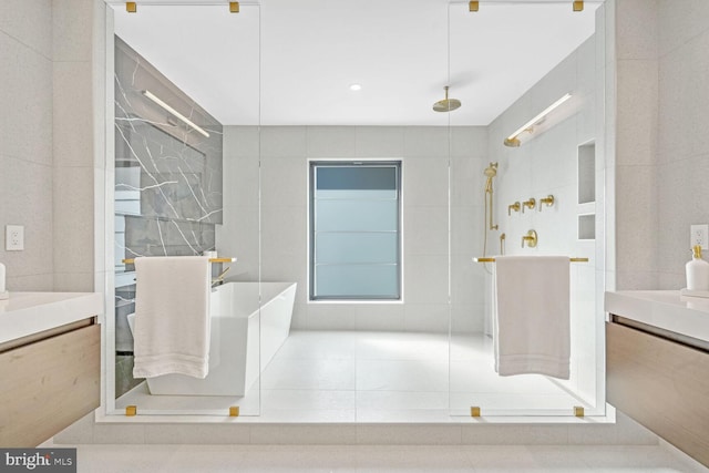 bathroom featuring vanity, shower with separate bathtub, and tile walls