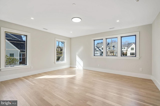 empty room with light wood-type flooring