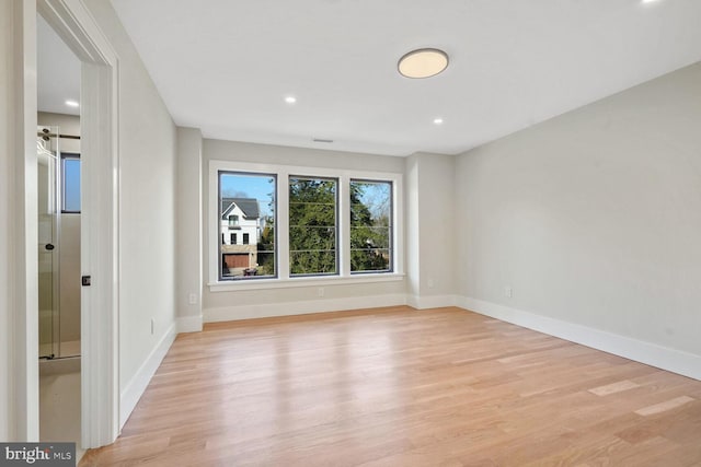 unfurnished room featuring light wood-type flooring