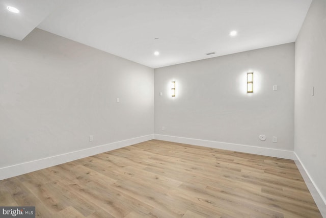 spare room featuring light wood-type flooring