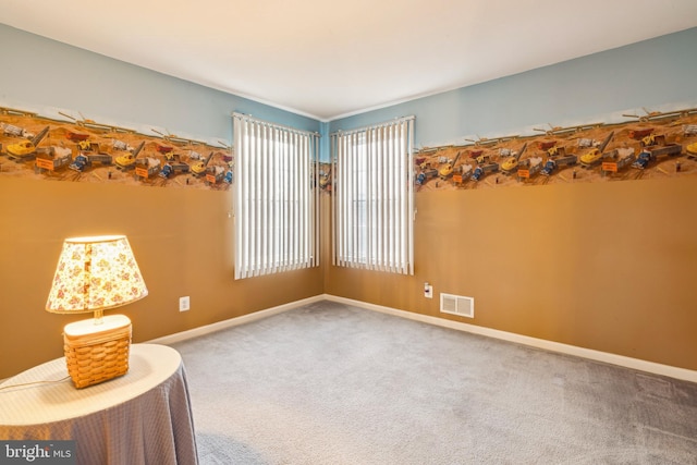 unfurnished room featuring carpet flooring