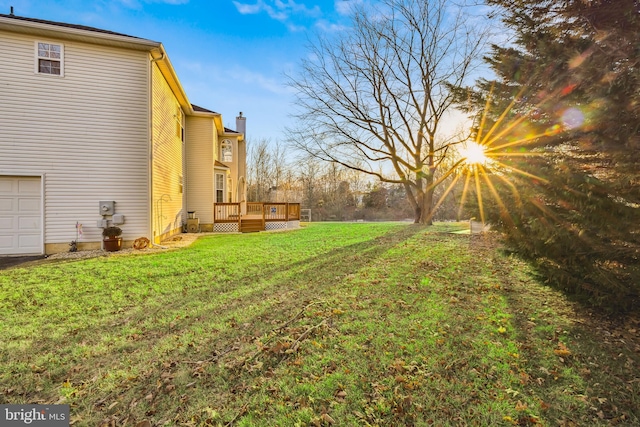 view of yard with a wooden deck