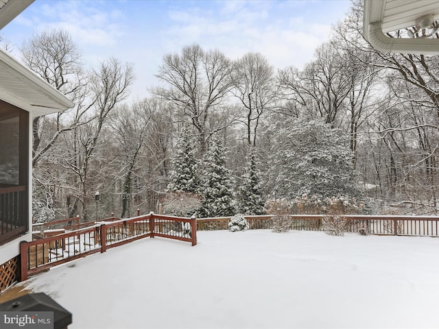 view of snow covered deck