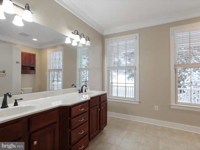 bathroom featuring ornamental molding, vanity, tile patterned floors, and toilet