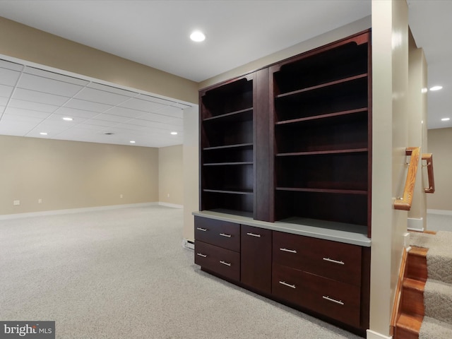 interior space featuring light colored carpet and baseboard heating