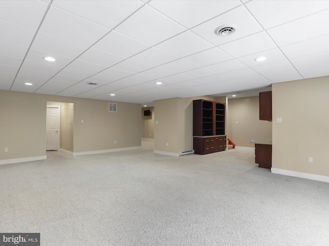 basement featuring a paneled ceiling