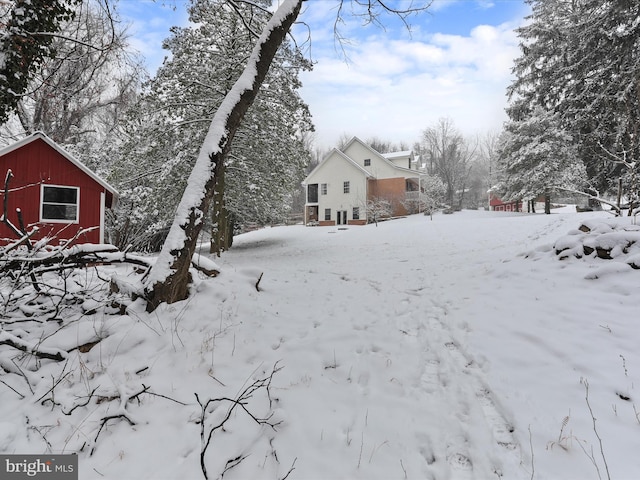 view of yard covered in snow