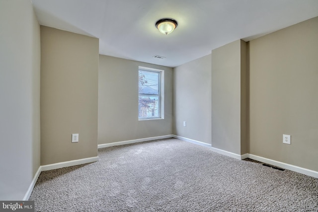 spare room featuring carpet floors