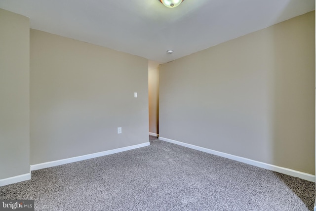 empty room with carpet flooring