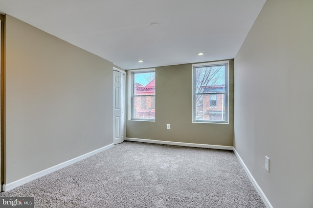 spare room featuring carpet