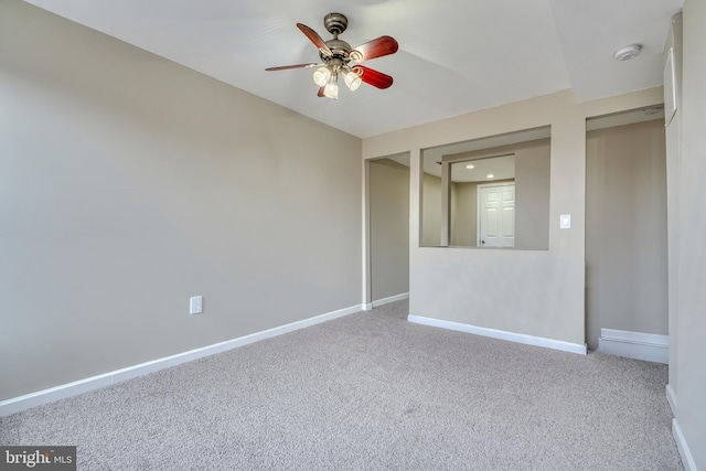 spare room featuring carpet floors and ceiling fan